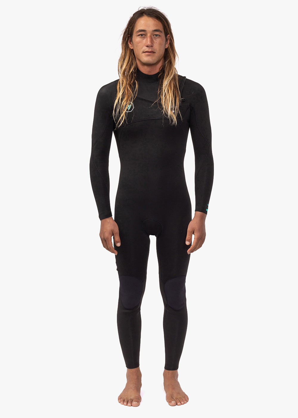 A person wearing a full-body black wetsuit with a chest zip feature.