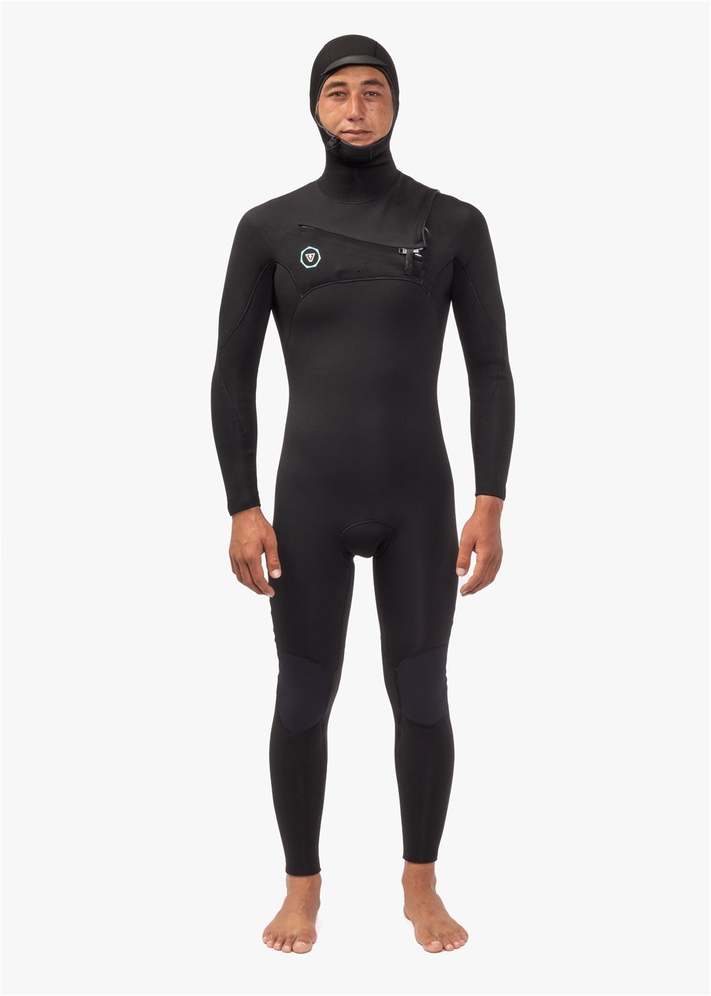 A person wearing a full hooded chest zip black wetsuit, standing against a white background.